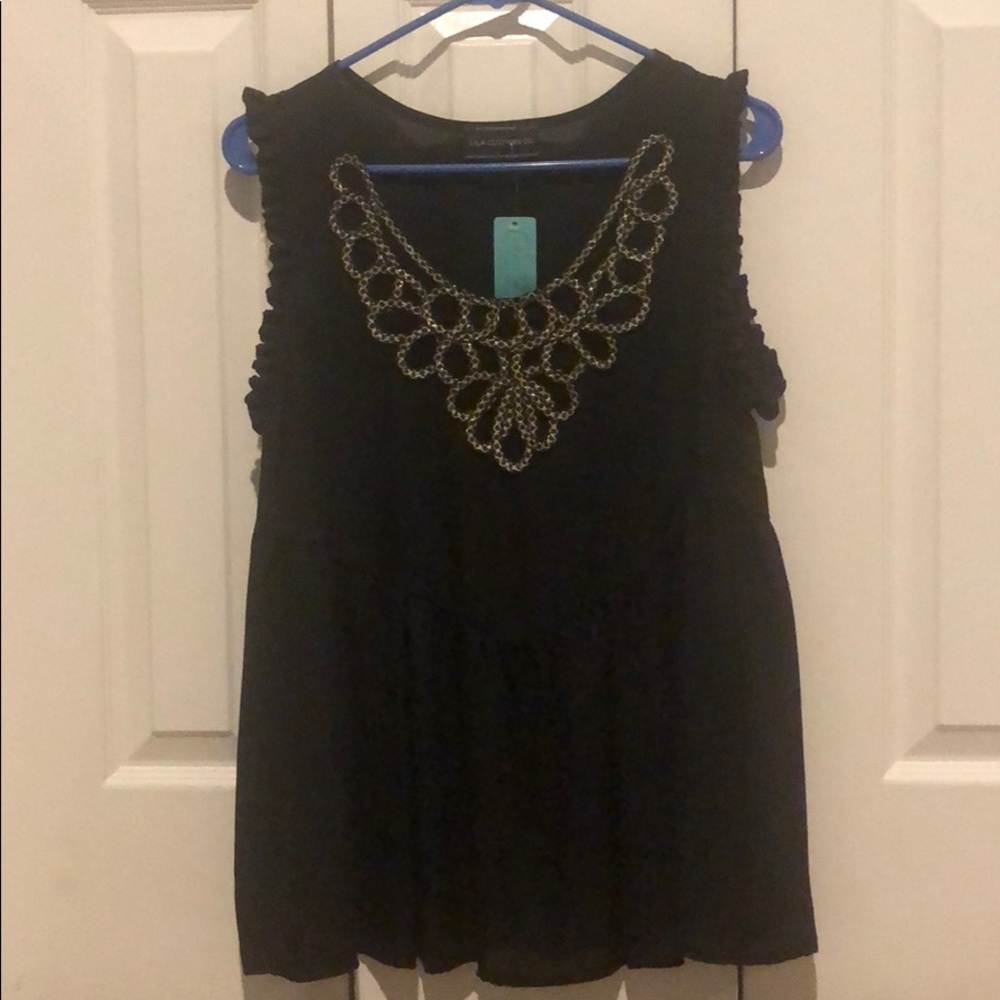 Black flowing sleeveless top with silver design